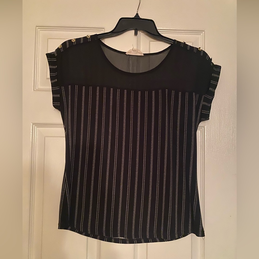 Black top sheer on shoulders . dressy or casual look